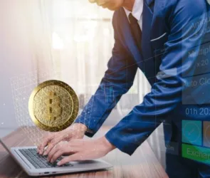 The man typing on his laptop trading cryptocurrency Bitcoin exchanges concept
