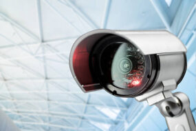 Security, CCTV camera for office building at night in London