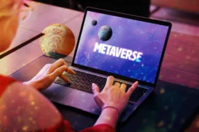 Metaverse concept Woman using laptop with planet screen